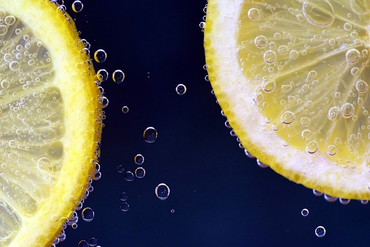 Lemons submerged in sparkling lemonade.